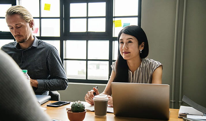 female-with-laptop-in-meeting